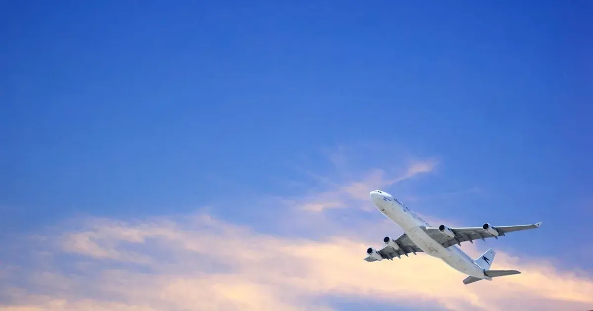 Passenger airplane flying in a clear blue sky