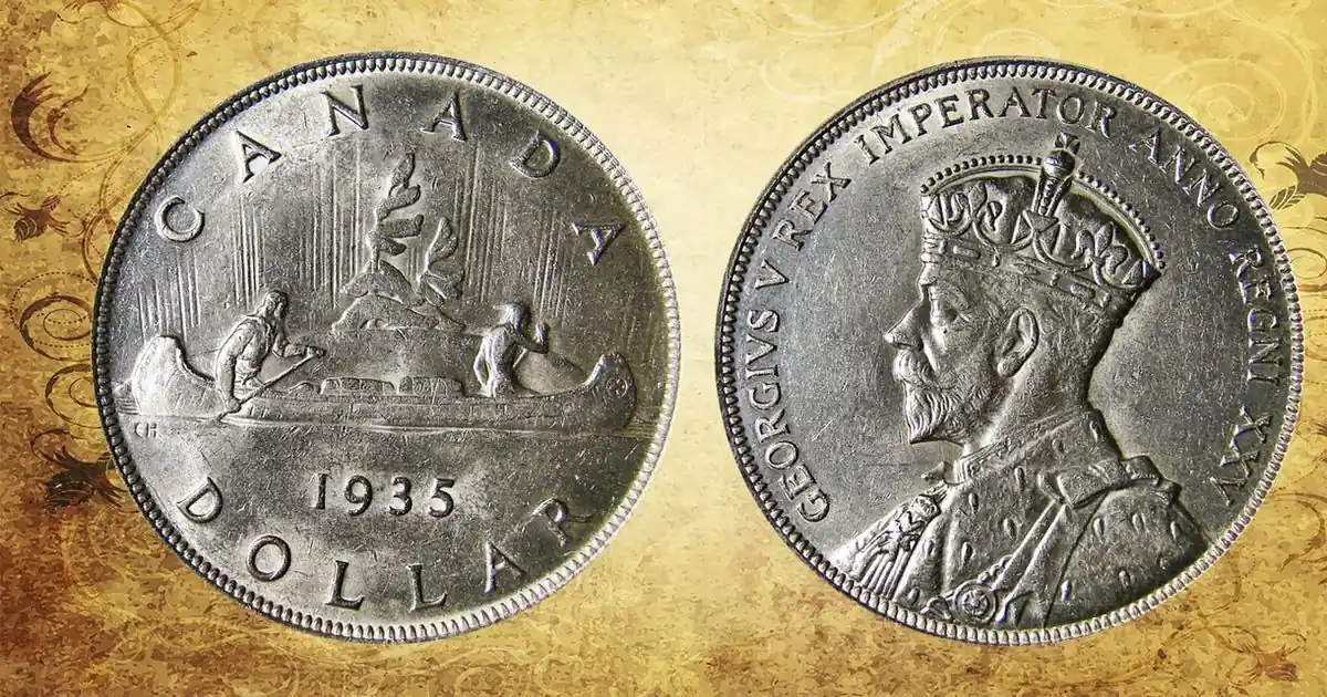 Both sides of a 1935 Canadian silver dollar coin showing a canoe with voyageurs and King George V (archive photo)