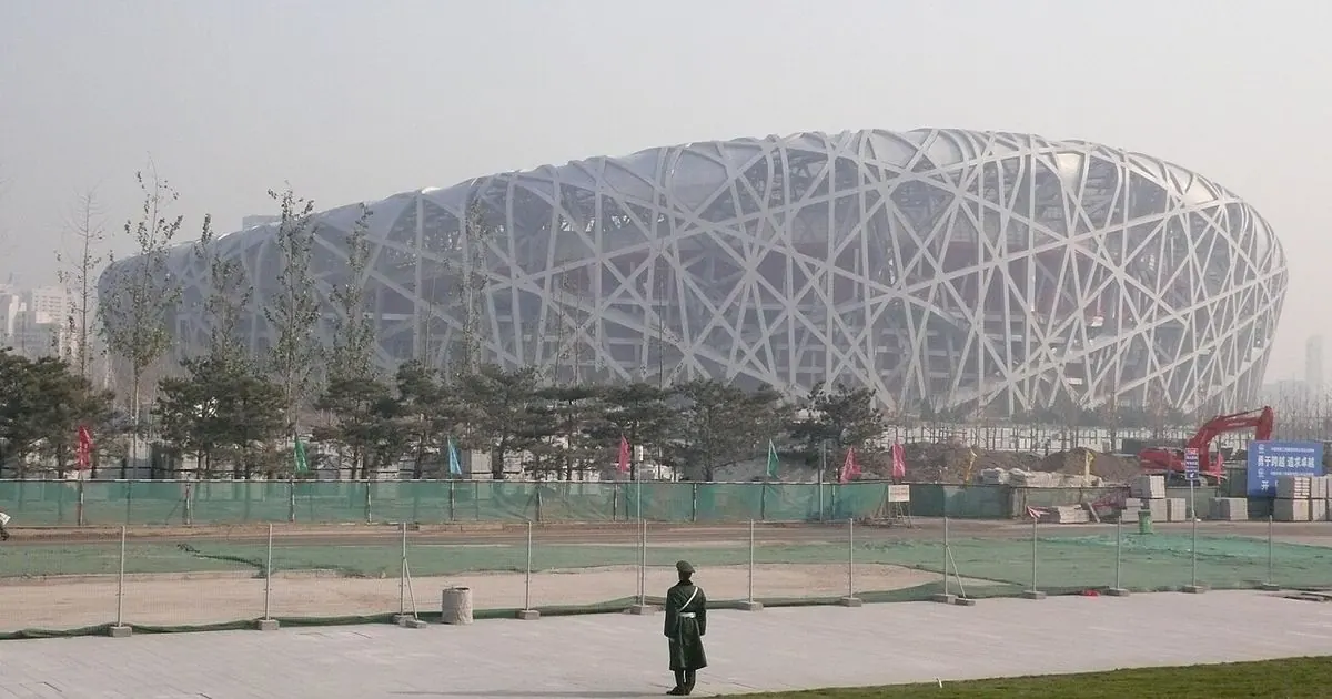 Beijing National Stadium exterior under blue sky