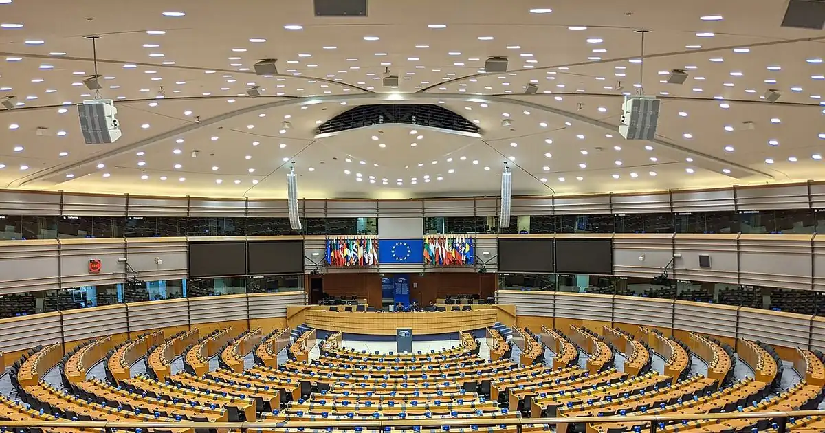 Empty green seats in the European Parliament chamber