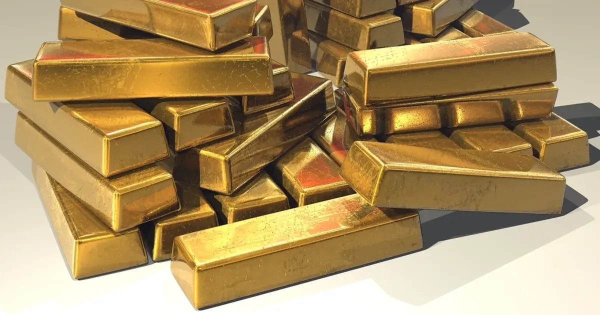 A pile of stacked shiny gold bars