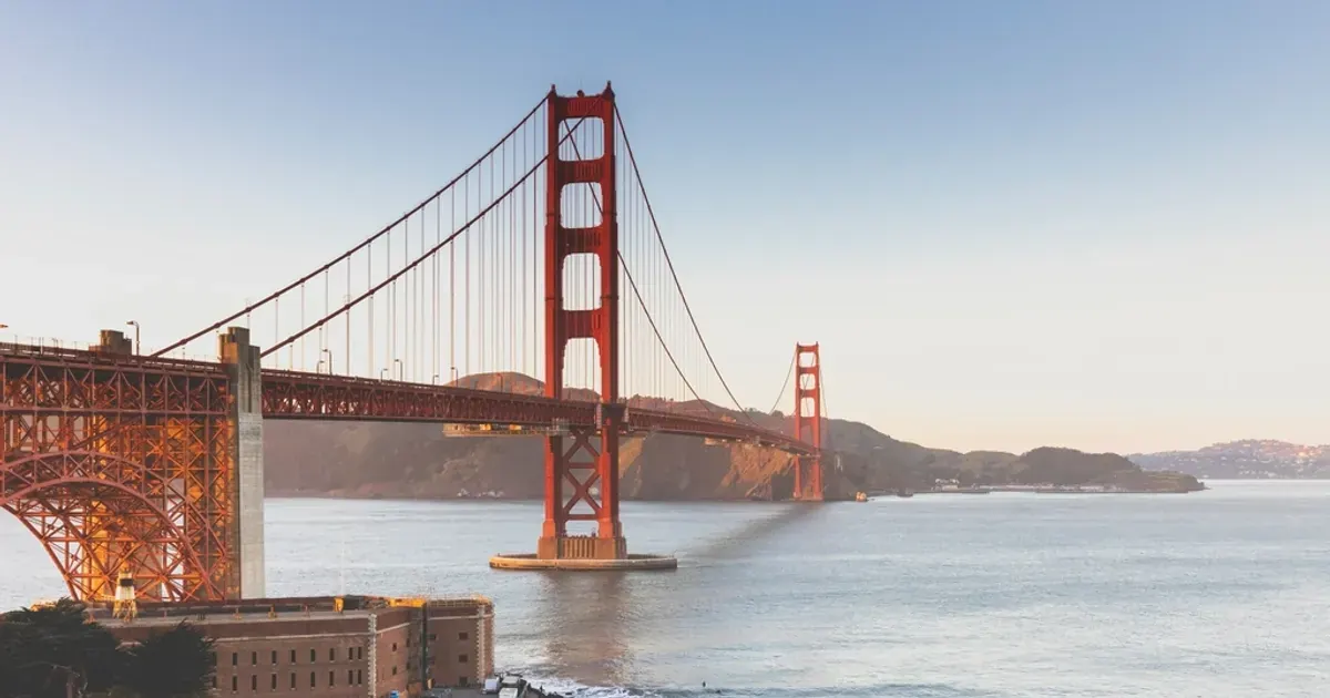 Golden Gate Bridge orange towers over San Francisco Bay