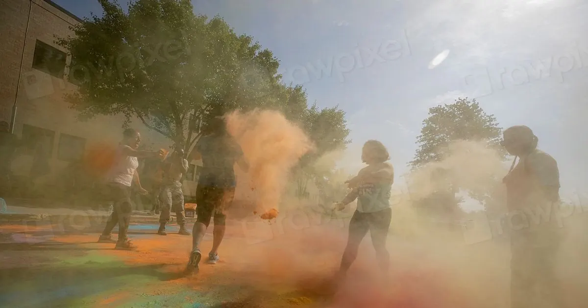People throwing colored powder during Holi festival