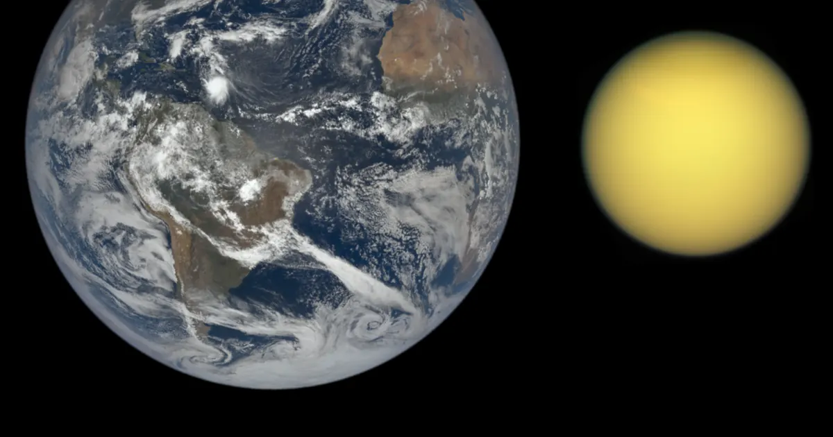 Earth and Saturn's moon Titan shown side by side to scale in natural colour, Titan a hazy orange-yellow ball