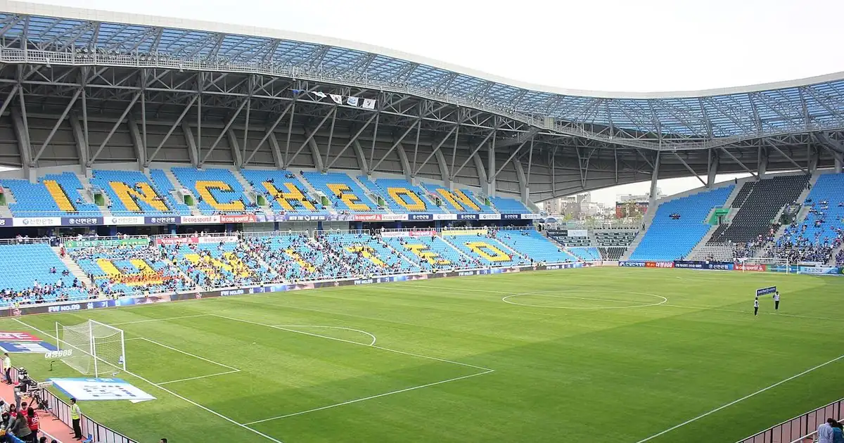 Stadium floodlights above curved seating