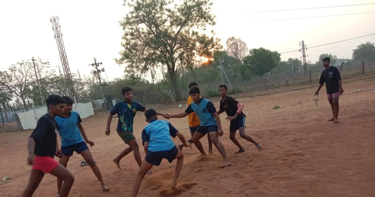 Players contesting a kabaddi raid on an outdoor court