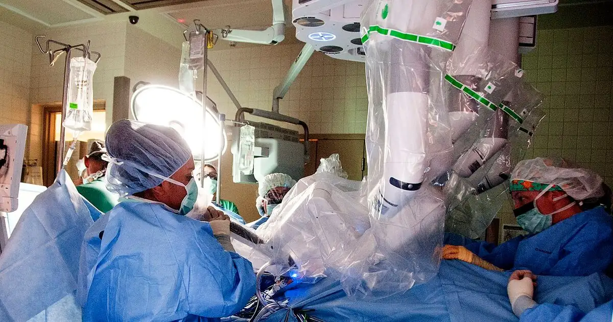 Surgical robot arms positioned over an operating table