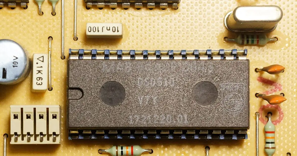 Close-up of a microcontroller chip soldered onto a circuit board