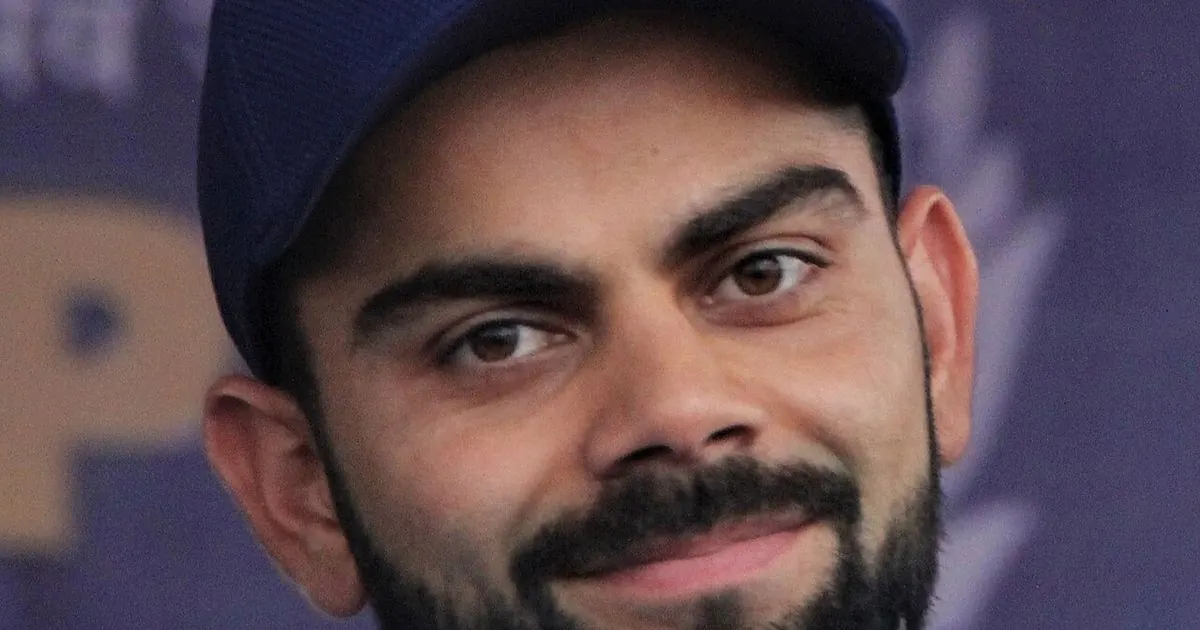 Portrait of Virat Kohli in India blue training kit and cap