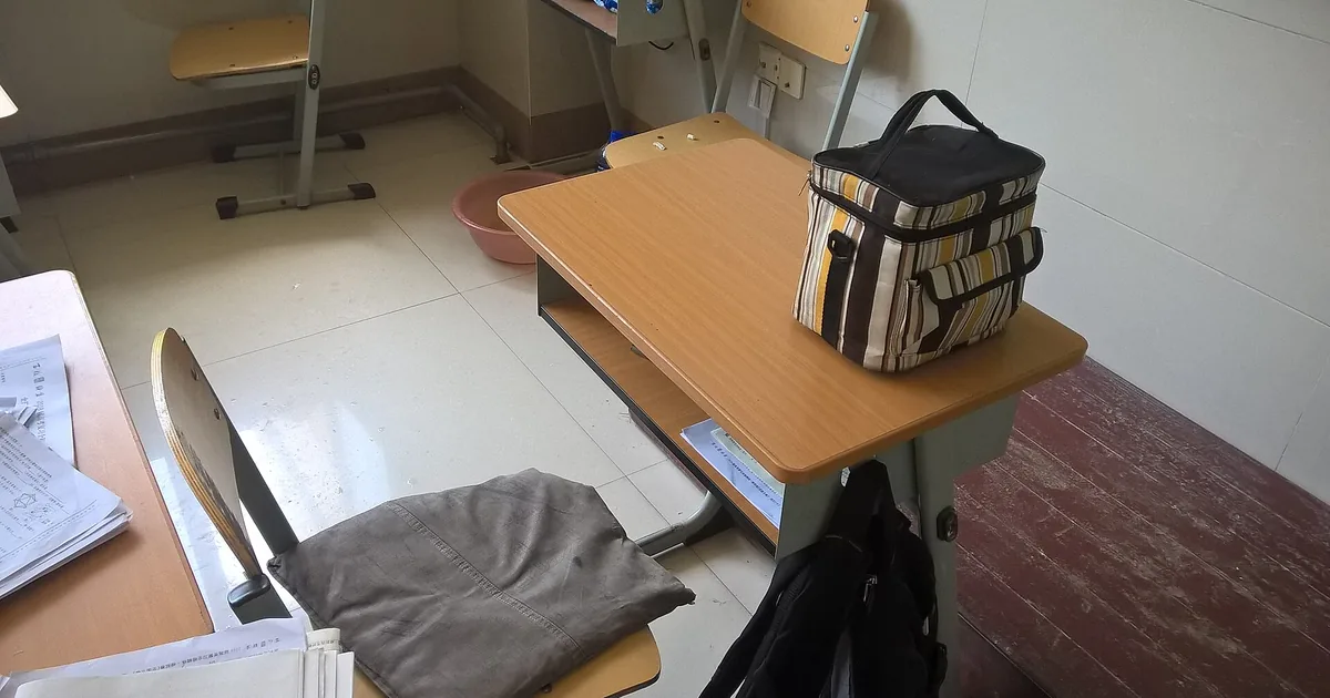 Rows of desks in a school classroom