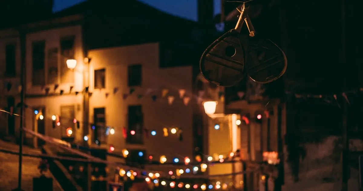Warm festival lights reflected on a wooden table