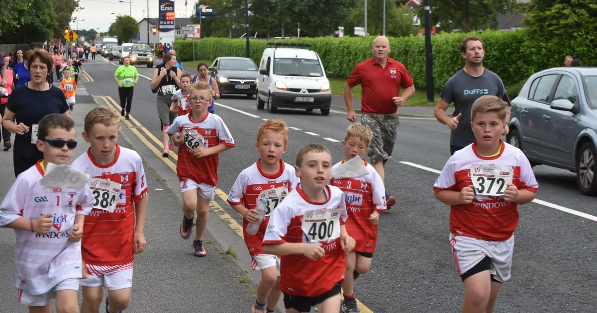 Runners on a marked road-race course