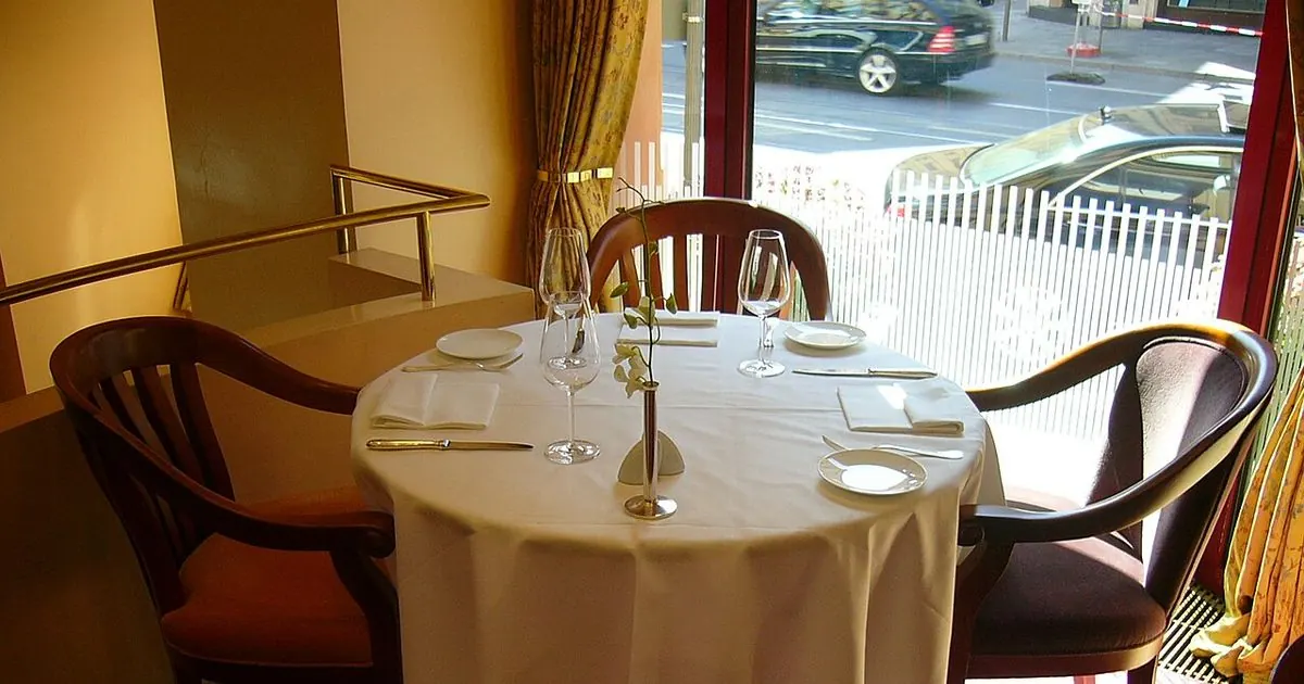 Restaurant table with plates and glasses