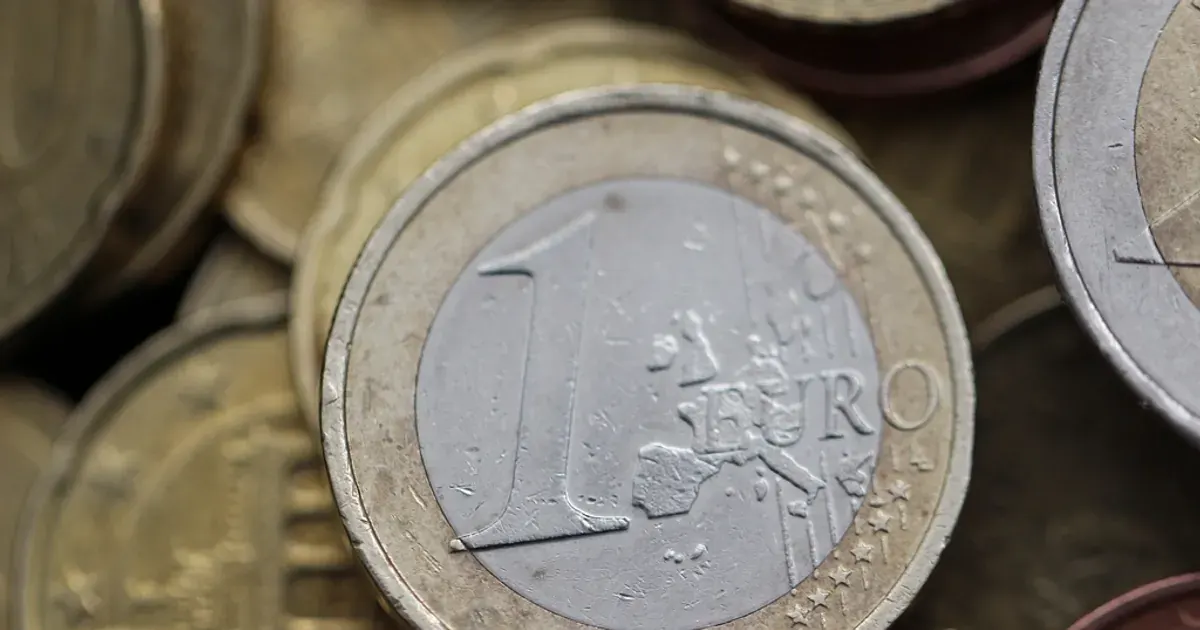 Close-up of euro coins stacked on a surface