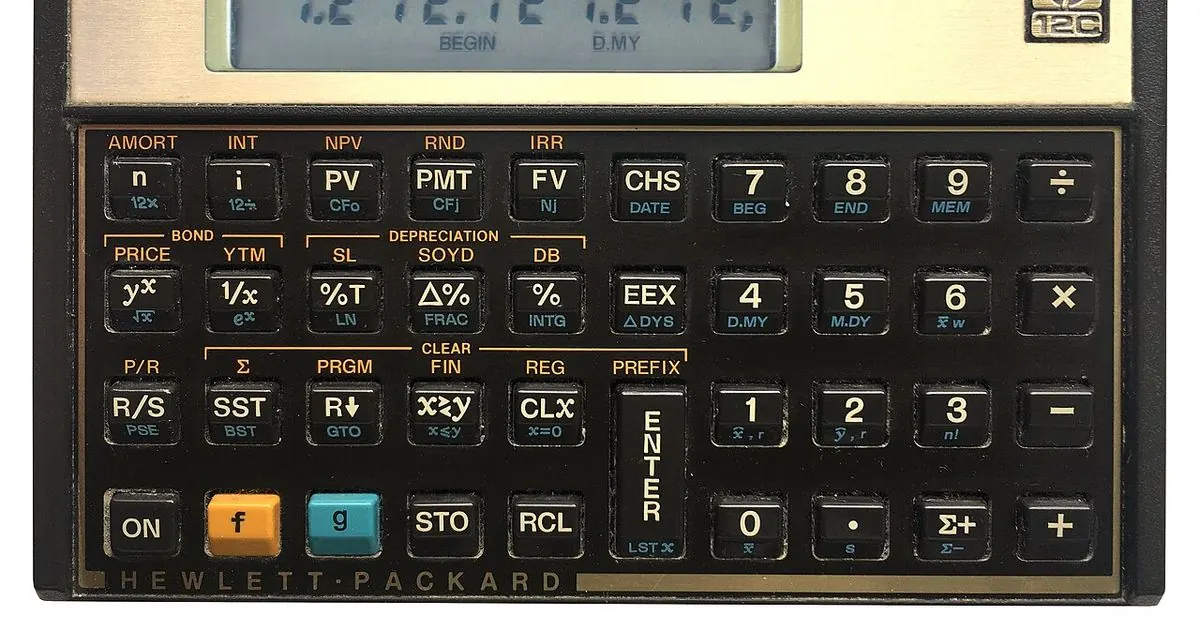 Calculator on a desk next to paper