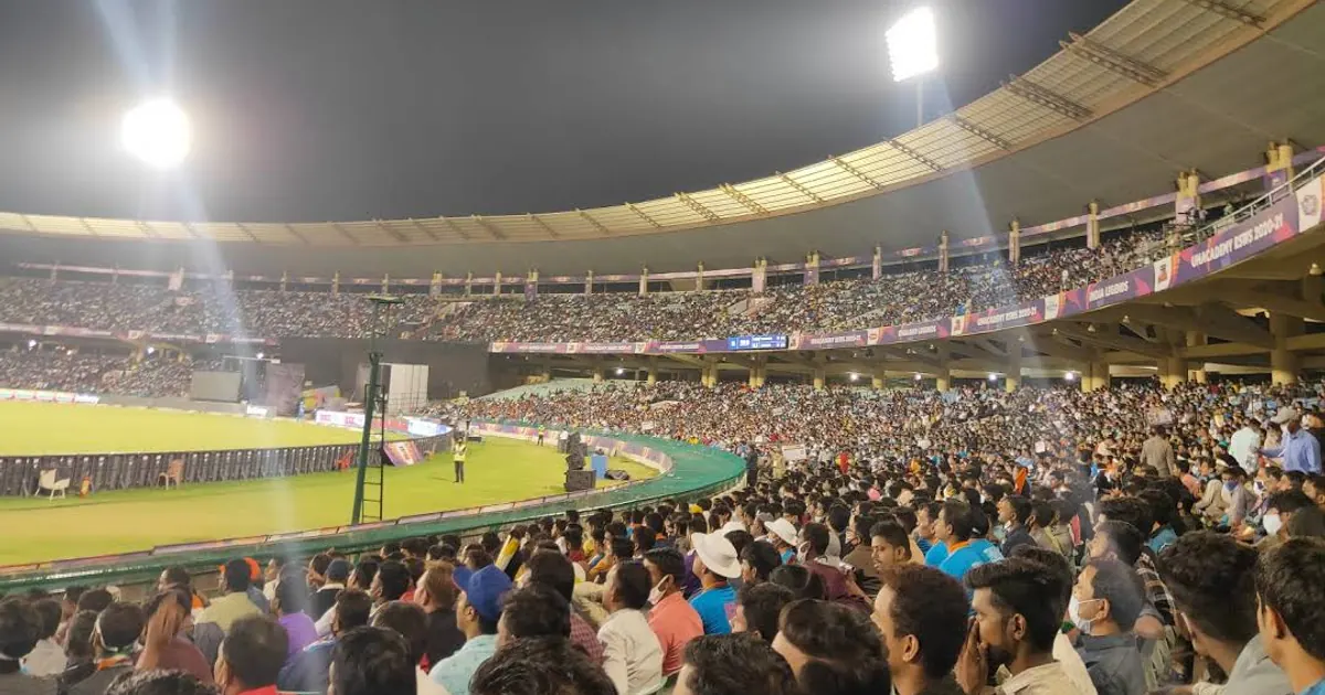 Cricket stadium green field under lights